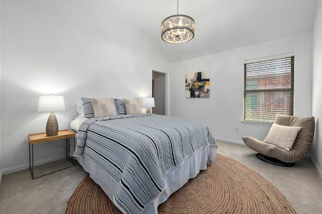 carpeted bedroom with a chandelier, vaulted ceiling, and baseboards