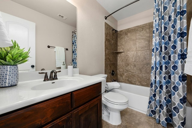 full bath featuring visible vents, toilet, tile patterned floors, shower / bath combo with shower curtain, and vanity