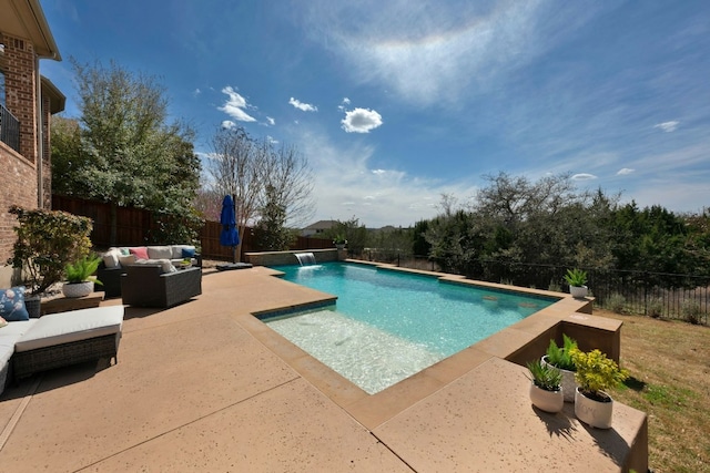 view of swimming pool featuring a patio area, a fenced backyard, and an outdoor hangout area