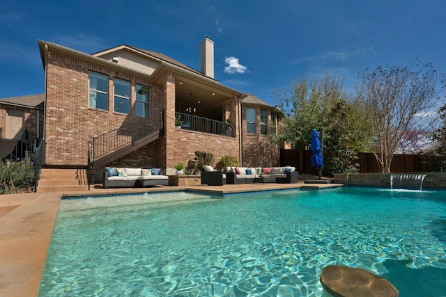 view of swimming pool with stairs, fence, outdoor lounge area, and a fenced in pool