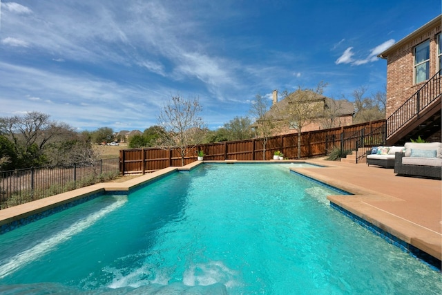 view of swimming pool featuring a patio area, a fenced backyard, outdoor lounge area, and a fenced in pool