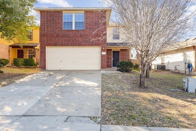 traditional-style home with a garage, concrete driveway, brick siding, and central AC