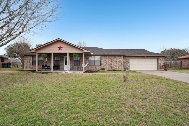 402 Laurel St, Bastrop, TX 78602 - view of front of home featuring a porch, driveway, an attached garage, and brick siding
