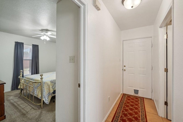 402 Laurel St, Bastrop, TX 78602 - hallway featuring light tile patterned flooring and baseboards