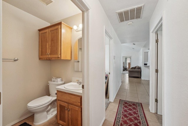 402 Laurel St, Bastrop, TX 78602 - bathroom featuring vanity, tile patterned floors, and lofted ceiling