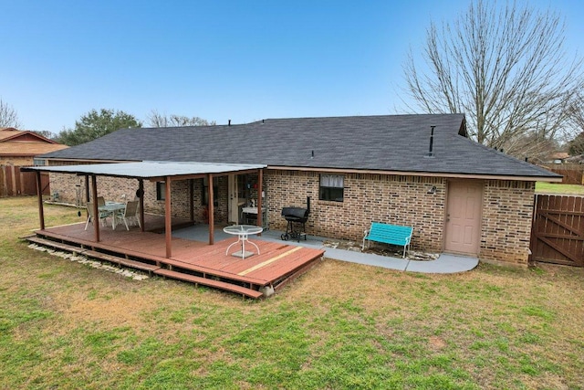 402 Laurel St, Bastrop, TX 78602 - back of property with brick siding, a deck, and a shingled roof