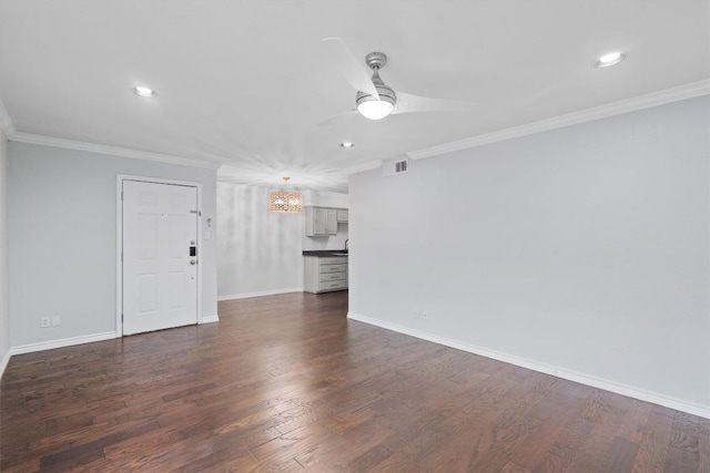 unfurnished living room with visible vents, ornamental molding, and dark wood-style flooring