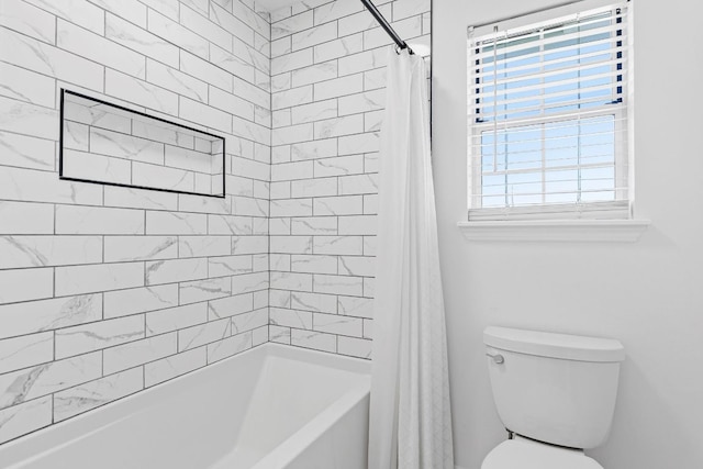 bathroom with shower / bath combo and toilet