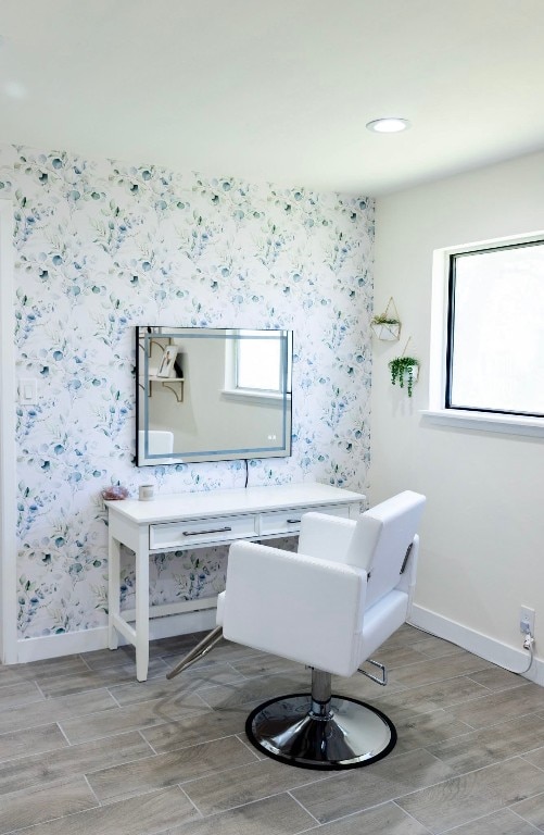 bathroom with baseboards, a wealth of natural light, and wallpapered walls