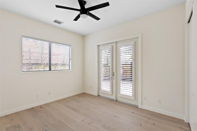 707 Cardinal Ln Unit E2, Austin, TX 78704 - unfurnished room with light wood finished floors, ceiling fan, and baseboards