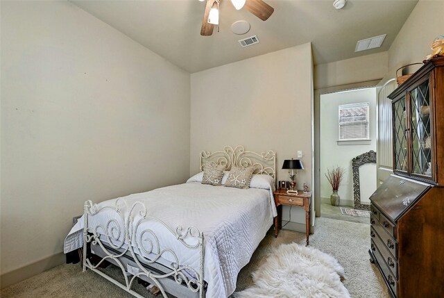 102 Maravilla Way, Horseshoe Bay, TX 78657 - carpeted bedroom featuring baseboards and a ceiling fan