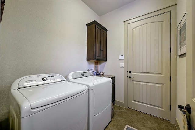 102 Maravilla Way, Horseshoe Bay, TX 78657 - laundry room featuring cabinet space, washing machine and dryer, and dark tile patterned flooring