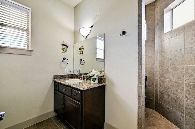 102 Maravilla Way, Horseshoe Bay, TX 78657 - full bathroom featuring vanity, a walk in shower, and tile patterned flooring