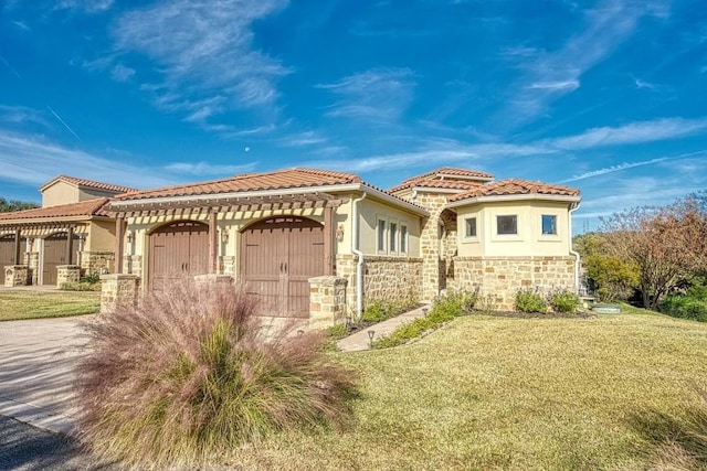 mediterranean / spanish house with stone siding, a tile roof, a front lawn, a pergola, and stucco siding