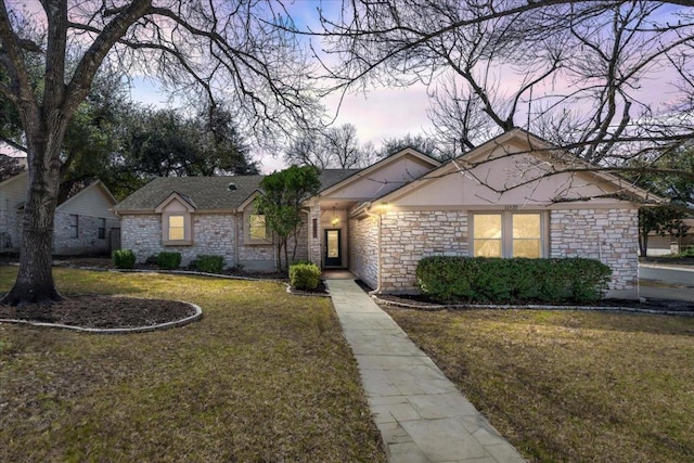 view of front of property with a lawn