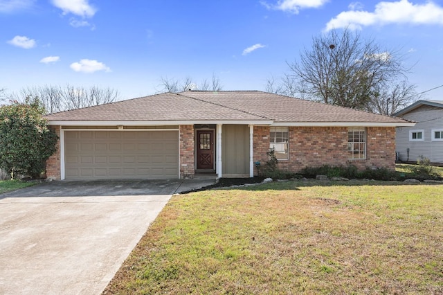 single story home featuring a garage, brick siding, driveway, and a front yard