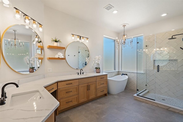30302 Berry Creek Dr, Georgetown, TX 78628 - full bath featuring a shower stall, a chandelier, visible vents, and a sink