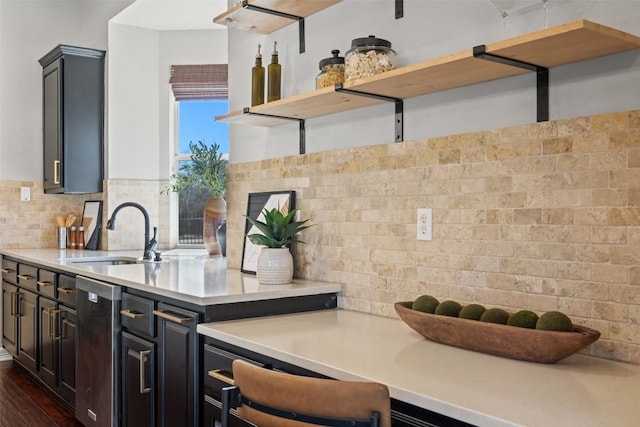 30302 Berry Creek Dr, Georgetown, TX 78628 - kitchen featuring open shelves, light countertops, decorative backsplash, and a sink