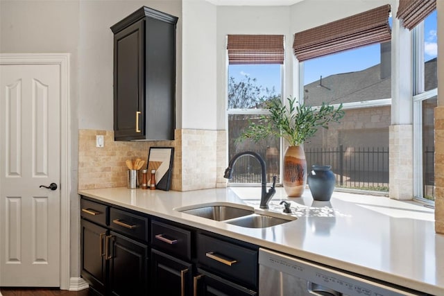 30302 Berry Creek Dr, Georgetown, TX 78628 - kitchen with dishwasher, decorative backsplash, a sink, and light countertops