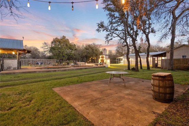 view of property's community featuring fence, a patio, and a yard