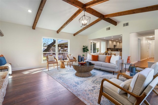 living room with vaulted ceiling with beams, a notable chandelier, visible vents, wood finished floors, and baseboards