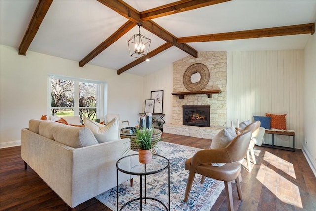 living area featuring a chandelier, lofted ceiling with beams, dark wood-style flooring, and a fireplace