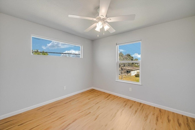 1500 Villanova Dr, Austin, TX 78757 - spare room with wood finished floors, healthy amount of natural light, and a ceiling fan