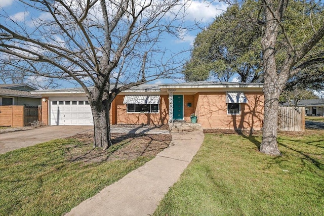 single story home with driveway, an attached garage, fence, a front lawn, and brick siding