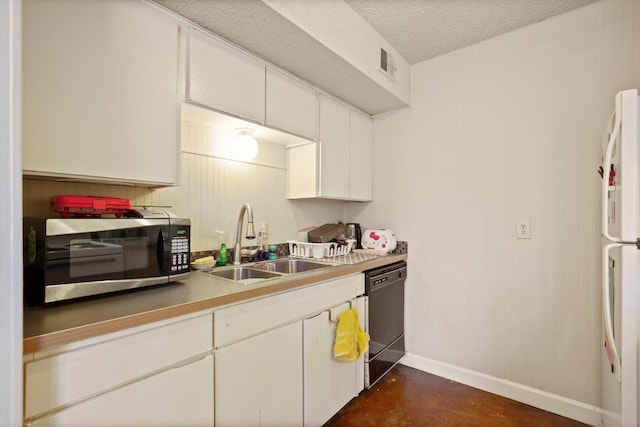 kitchen with baseboards, dishwasher, stainless steel microwave, freestanding refrigerator, and a sink