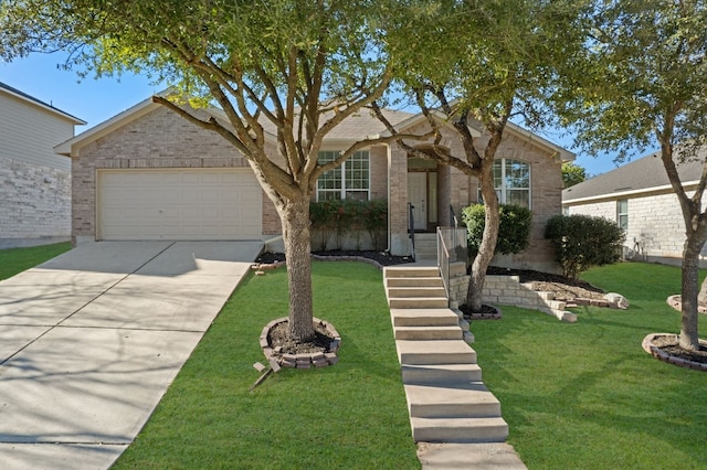 ranch-style home with a garage, a front yard, concrete driveway, and brick siding