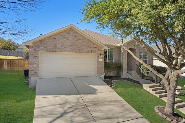 ranch-style home featuring brick siding, a front yard, fence, a garage, and driveway