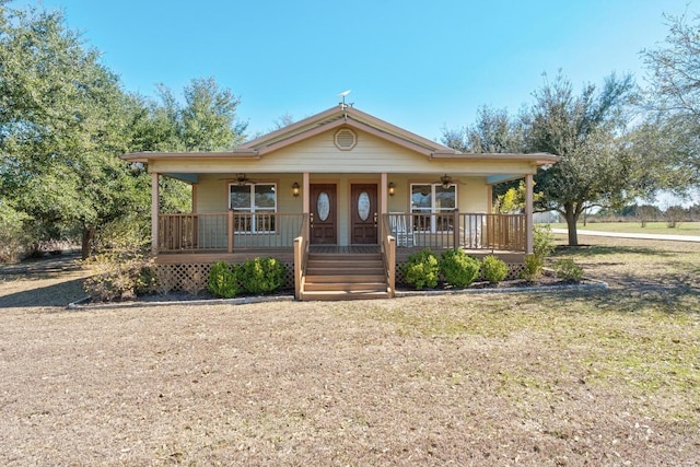 view of front of house featuring ceiling fan and a porch