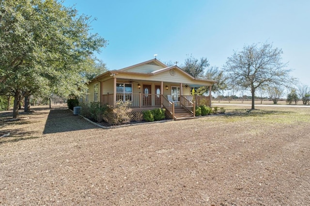 view of front of home featuring covered porch and central AC