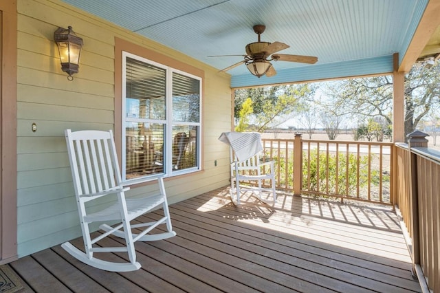 wooden terrace featuring ceiling fan