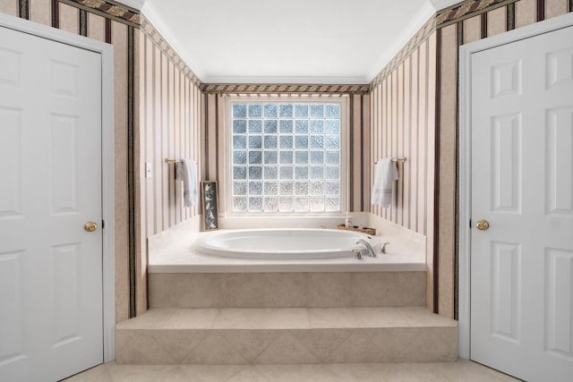 full bathroom featuring ornamental molding, tile patterned flooring, a garden tub, and wallpapered walls