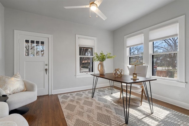 office featuring ceiling fan, wood finished floors, and baseboards