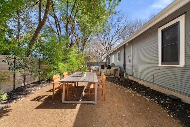 view of patio featuring outdoor dining area and a fenced backyard