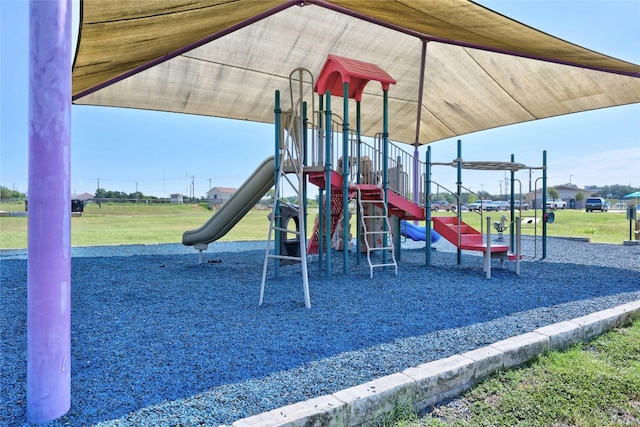 community play area featuring a lawn