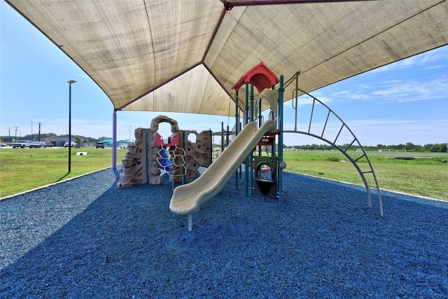 community jungle gym with a lawn