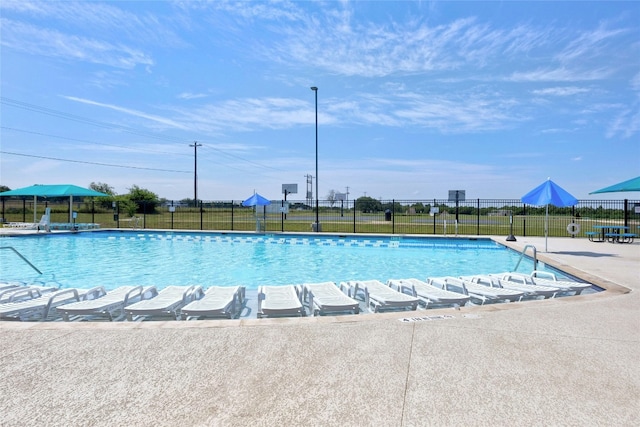 community pool featuring fence