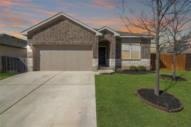 single story home featuring a garage, stone siding, a yard, and fence