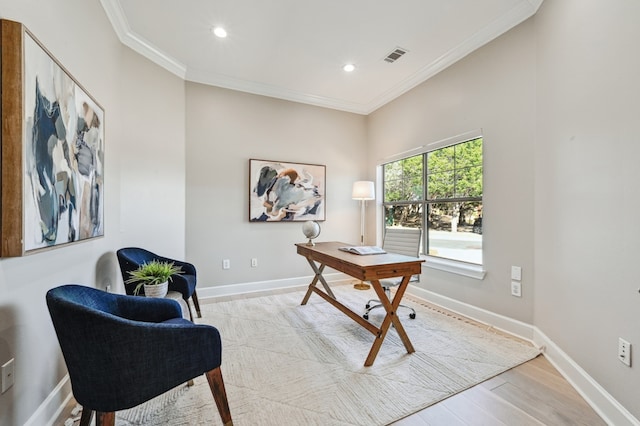 office space with baseboards, visible vents, and crown molding