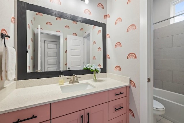 full bathroom featuring toilet, shower / bathing tub combination, and vanity