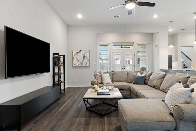 living room with ceiling fan, visible vents, baseboards, french doors, and dark wood-style floors