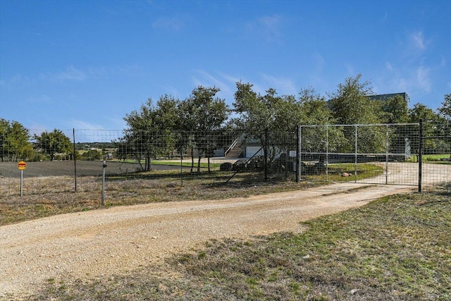 7875 W Fitzhugh Rd, Dripping Springs, TX 78620 - view of home's community with a gate and driveway