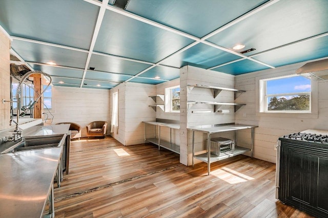 7875 W Fitzhugh Rd, Dripping Springs, TX 78620 - kitchen featuring wood finished floors and wood walls