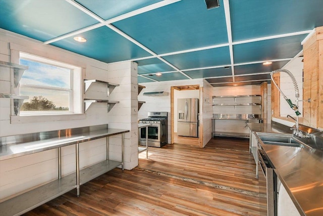 7875 W Fitzhugh Rd, Dripping Springs, TX 78620 - kitchen featuring stainless steel countertops, appliances with stainless steel finishes, dark wood finished floors, and range hood