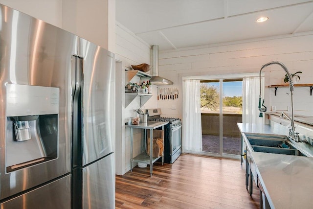 7875 W Fitzhugh Rd, Dripping Springs, TX 78620 - kitchen featuring stainless steel appliances, open shelves, light wood-type flooring, light countertops, and recessed lighting