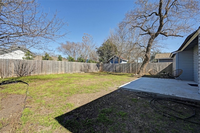 view of yard with a patio and a fenced backyard