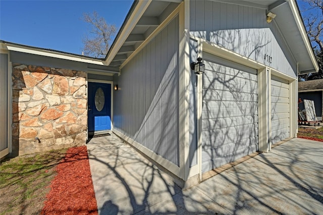 property entrance featuring stone siding